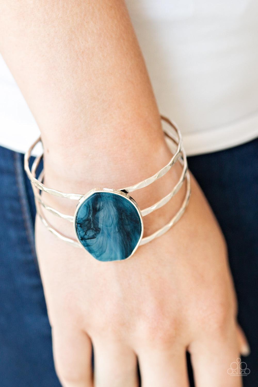 Paparazzi Accessories Canyon Dream - Blue Featuring a faux rock finish, a refreshing blue acrylic piece sits atop a trio of hammered silver bars that coalesce into an airy cuff for an artisan inspired look. Color may vary. Jewelry