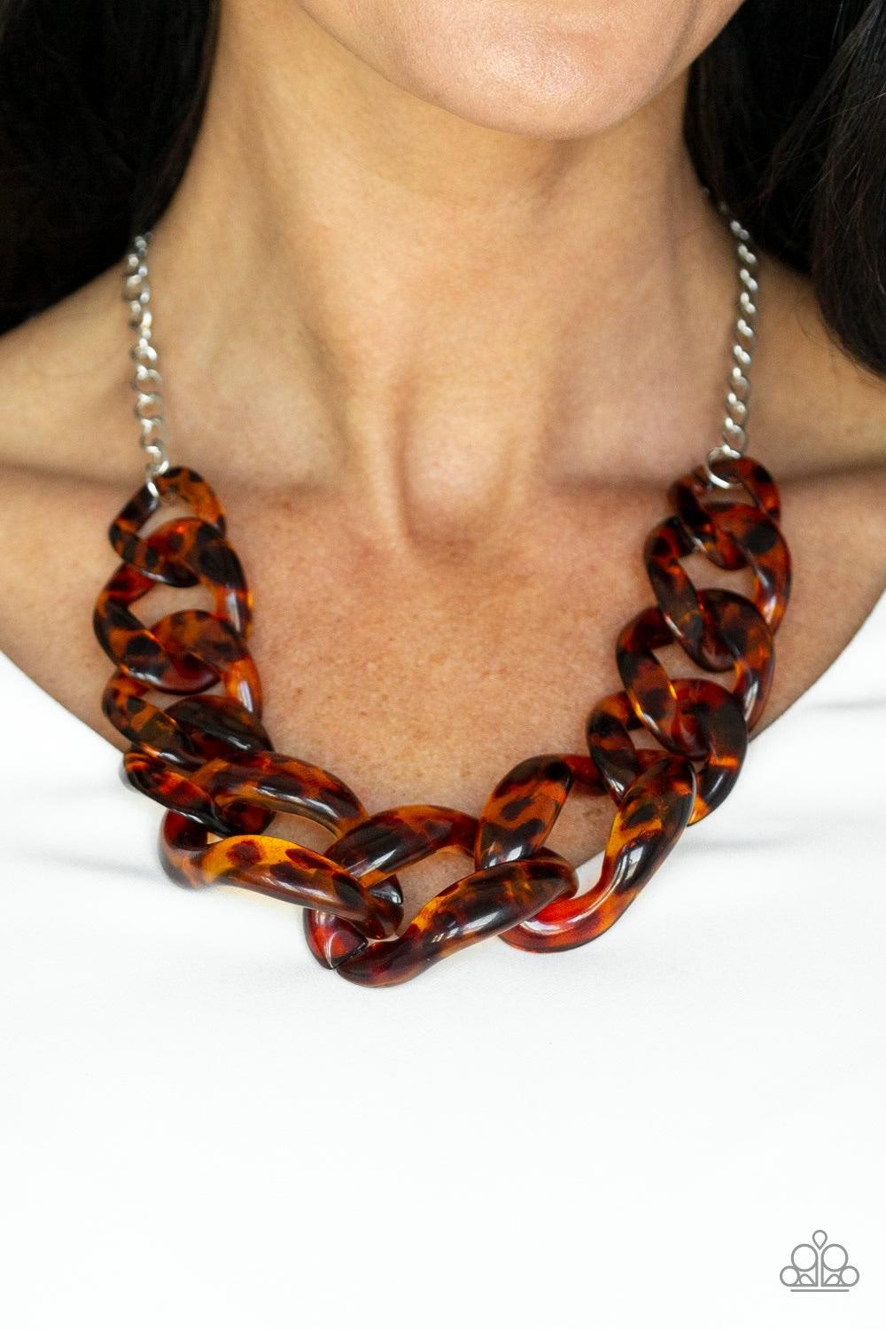 Paparazzi Accessories Red-HAUTE Mama - Brown Featuring a tortoise shell finish, brown acrylic links gradually increase in size as they link below the collar in a statement-making fashion. Features an adjustable clasp closure. Jewelry