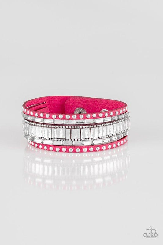 Paparazzi Accessories Rock Star Rocker - Pink Shiny silver studs, dainty silver ball chains, and edgy white emerald-cut rhinestones race along a spliced pink suede band for a rock star look. Features an adjustable snap closure.Sold as one individual brace