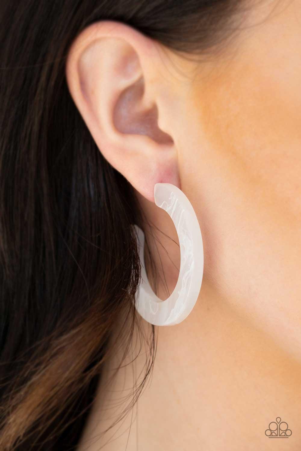 Paparazzi Accessories Oceanside Oasis - White Featuring a smoky white finish, an opaque hoop curls around the ear for a colorfully retro look. Earring attaches to a standard post fitting. Hoop measures 1 3/4" in diameter.
