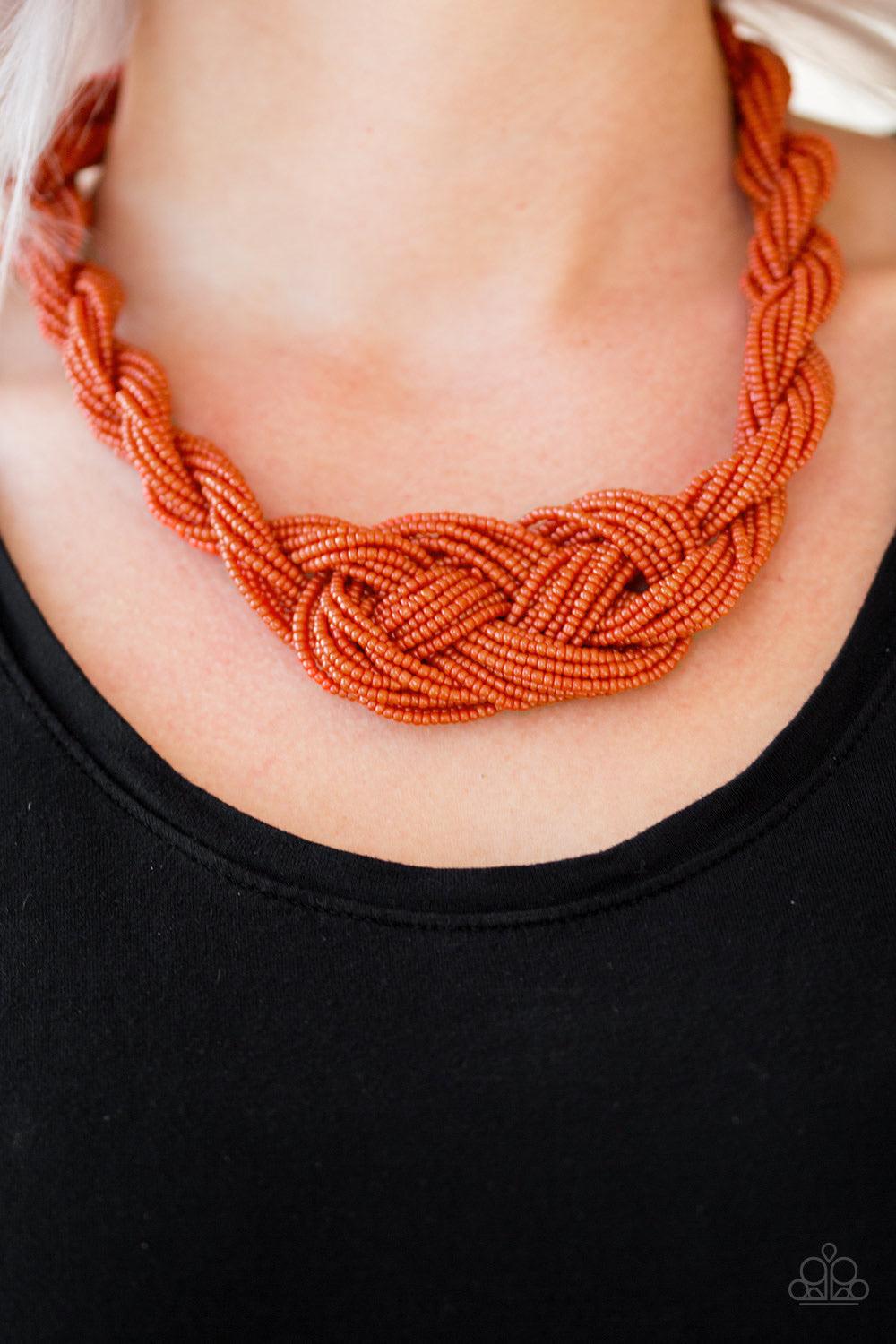 Paparazzi Accessories A Standing Ovation - Orange Countless strands of burnt orange seed beads are twisted and knotted together to create an unforgettable statement piece. Features an adjustable clasp closure. Jewelry