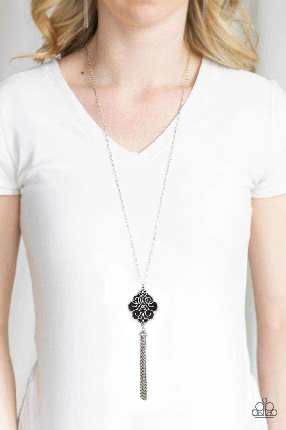 Paparazzi Accessories Malibu Mandala - Black Shimmery silver filigree swirls across a shiny black backdrop, coalescing into a colorful pendant. A glistening silver chain tassel swings from the bottom of the pendant for a whimsical finish. Features an adju