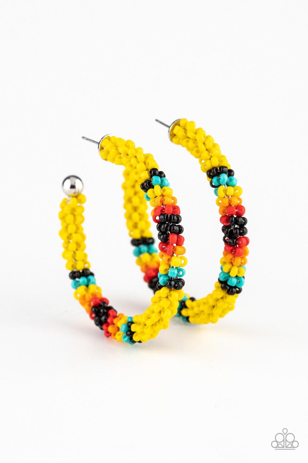 Paparazzi Accessories Bodaciously Beaded - Yellow A colorful strand of yellow, black, blue, red, and orange seed beads wraps around a shiny silver hoop, creating a colorfully seasonal look. Earring attaches to a standard post fitting. Hoop measures approx