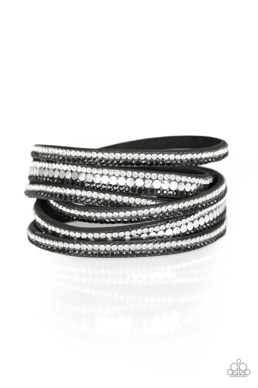 Paparazzi Accessories Rock Star Attitude - Black Encrusted in rows of glittery black and white rhinestones and flat silver studs, three strands of black suede wrap around the wrist for a sassy look. The elongated band allows for a trendy double wrap aroun