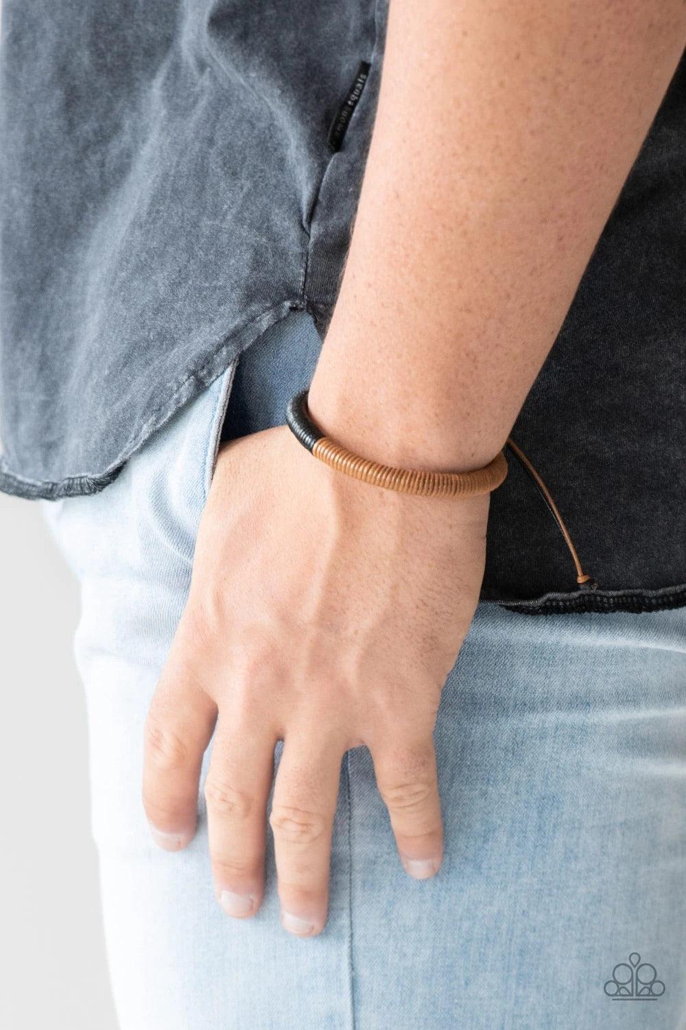 Paparazzi Accessories TRACKER and Field - Brown Earthy brown cording fades into shiny black cording across the wrist for a seasonal look. Features an adjustable sliding knot closure.Sold as one individual bracelet. Jewelry