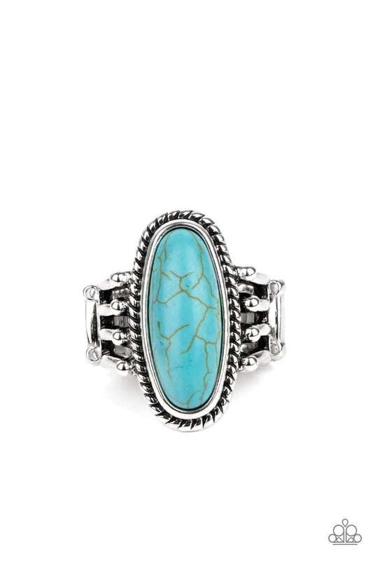 Paparazzi Accessories Home on the Ranch - Blue An oblong turquoise stone is pressed into the center of a textured silver frame attached to the studded ends of layered silver bands, creating a colorful rustic centerpiece atop the finger. Features a stretch