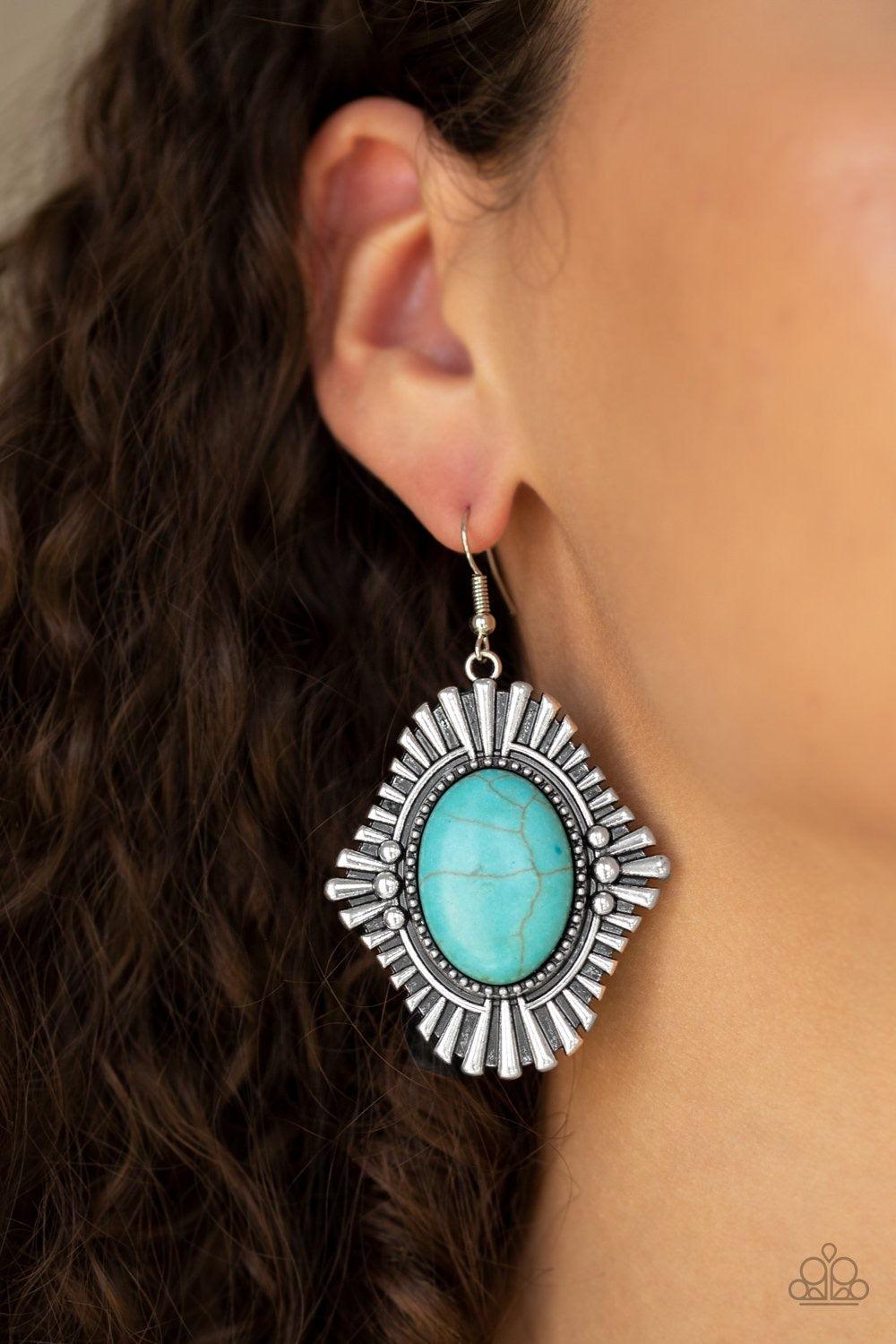 Paparazzi Accessories Easy As A Pioneer - Blue Dotted with studded accents, blunted silver frames flare from a turquoise stone center for a seasonal look. Earring attaches to a standard fishhook fitting. Jewelry