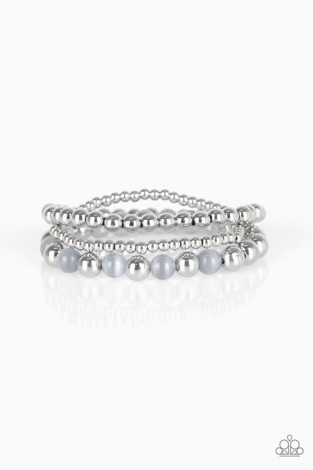 Paparazzi Accessories Always On The Glow - Silver Infused with glowing gray moonstones, shiny silver beads are threaded along stretchy bands for a whimsical look. Sold as one set of three bracelets. Jewelry