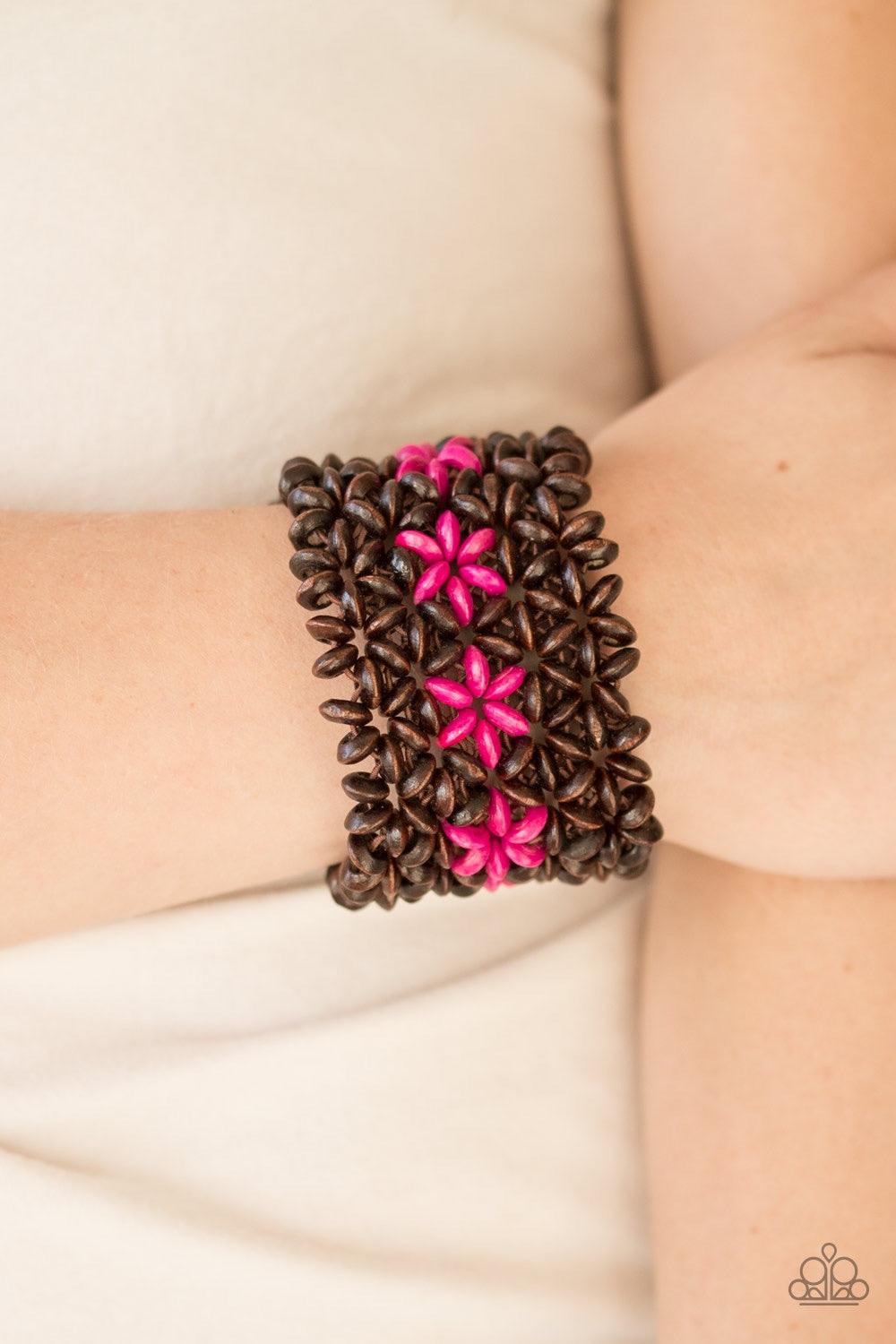 Paparazzi Accessories Bahama Babe - Pink Earthy wooden accents are threaded along elastic stretchy bands, creating an ornate bracelet. Tinted in a vivacious finish, pink wooden beads gather down the center, creating summery floral accents for a colorful f