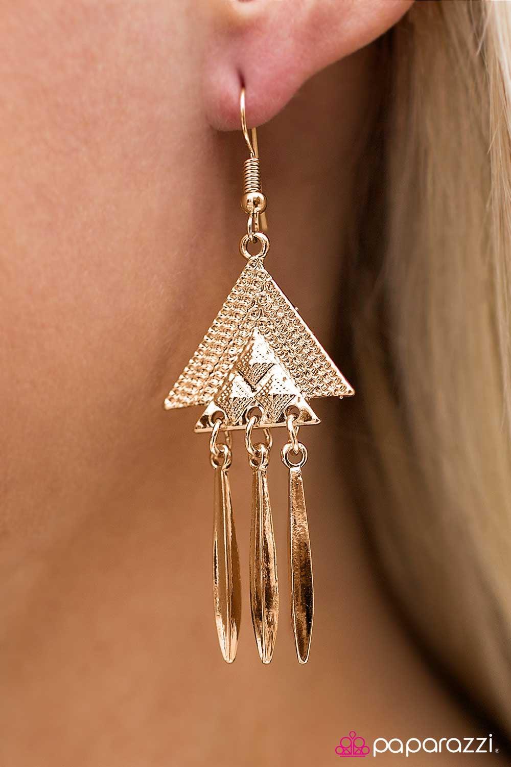 Paparazzi Accessories Desert Star - Gold Stacked golden triangles fall from the ear in a tribal inspired fashion. Featuring a high-sheen matte, flared bars swing from the bottom of the design for a whimsical finish. Earring attaches to a standard fishhook