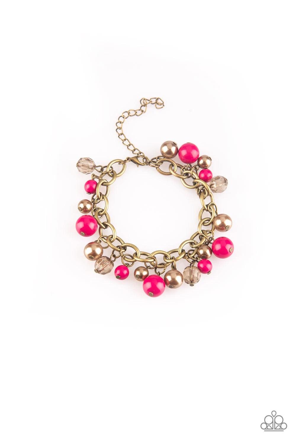 Paparazzi Accessories Grit and Glamour - Pink Pearly brass, polished pink, and glittery crystal-like beads swing from a bold brass chain, creating a refined fringe around the wrist. Features an adjustable clasp closure. Sold as one individual bracelet. Je