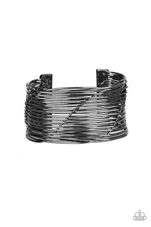 Paparazzi Accessories Retro Revamp - Black A glistening gunmetal wire weaves through stacked gunmetal bars arcing across the wrist, coalescing into an edgy cuff. Jewelry