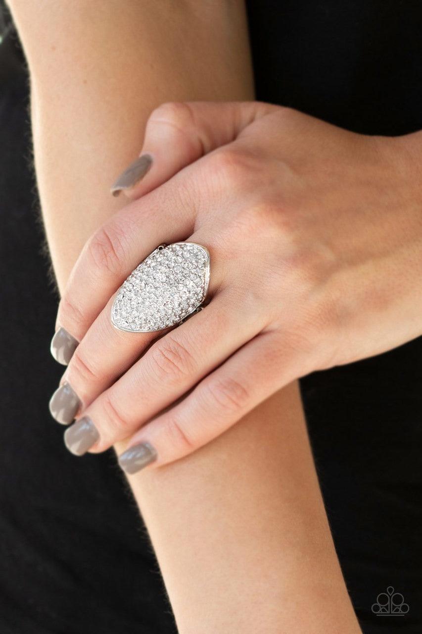 Paparazzi Accessories Shazam! - White Encrusted in row after row of glittery hematite rhinestones, a dramatic silver frame folds around the finger for a statement-making finish. Features a stretchy band for a flexible fit. Jewelry