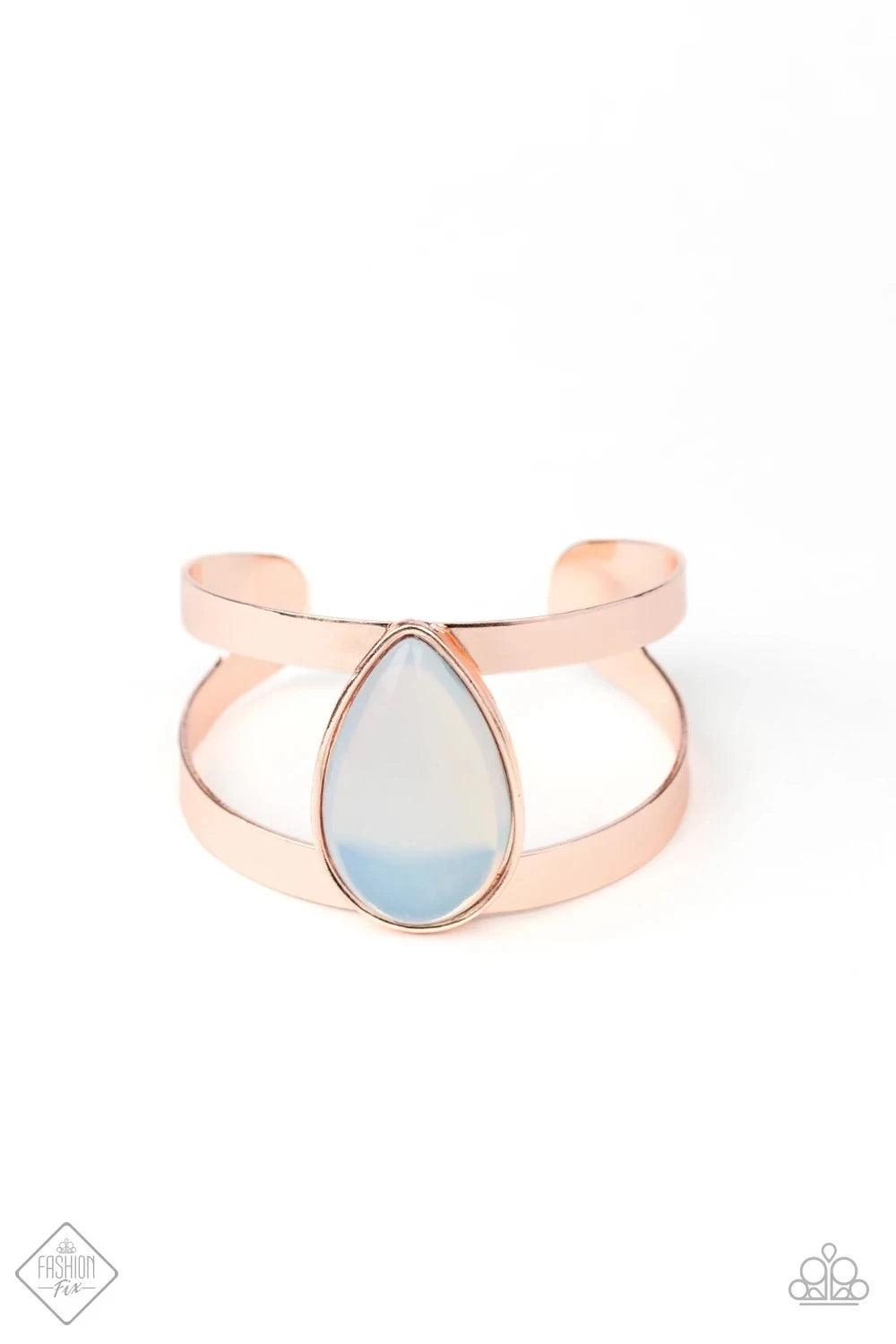 Paparazzi Accessories Optimal Opalescence - Gold Featuring a sleek rose gold frame, an opalescent white teardrop bead sits atop an airy rose gold cuff in an ethereal fashion. Sold as one individual bracelet. Jewelry