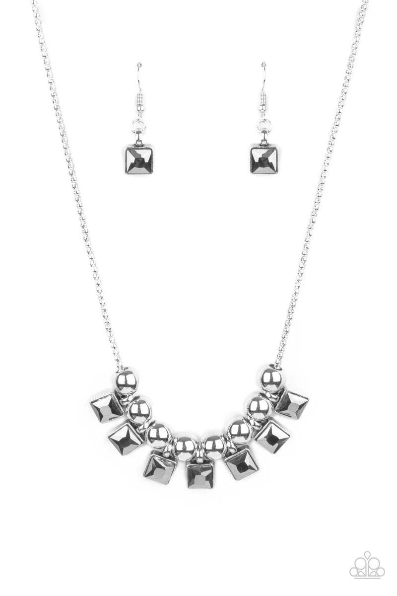 Paparazzi Accessories Graciously Audacious - White Smoky hematite square rhinestone frames and oversized silver beads alternate along a silver popcorn chain, creating a stellar fringe below the collar. Features an adjustable clasp closure. Sold as one ind