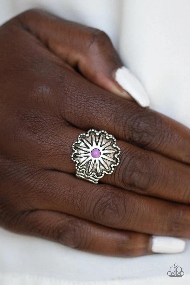 Paparazzi Accessories Stone Sensei - Purple A dainty purple stone bead is pressed into the center of an antiqued silver frame radiating with floral detail for a seasonal flair. Features a stretchy band for a flexible fit. Sold as one individual ring. Jewe