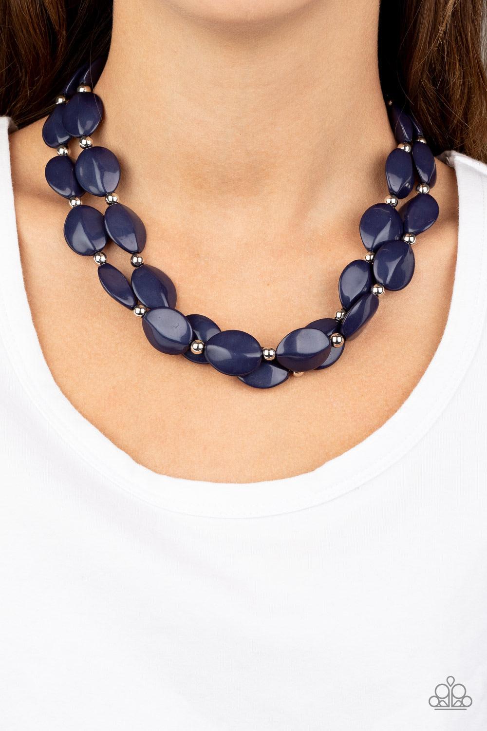 Paparazzi Accessories Two-Story Stunner - Blue Two rows of dainty silver beads and faceted Blue Depths faux stone beads alternate along invisible wires below the collar, creating bold, colorful layers. Features an adjustable clasp closure. Sold as one ind