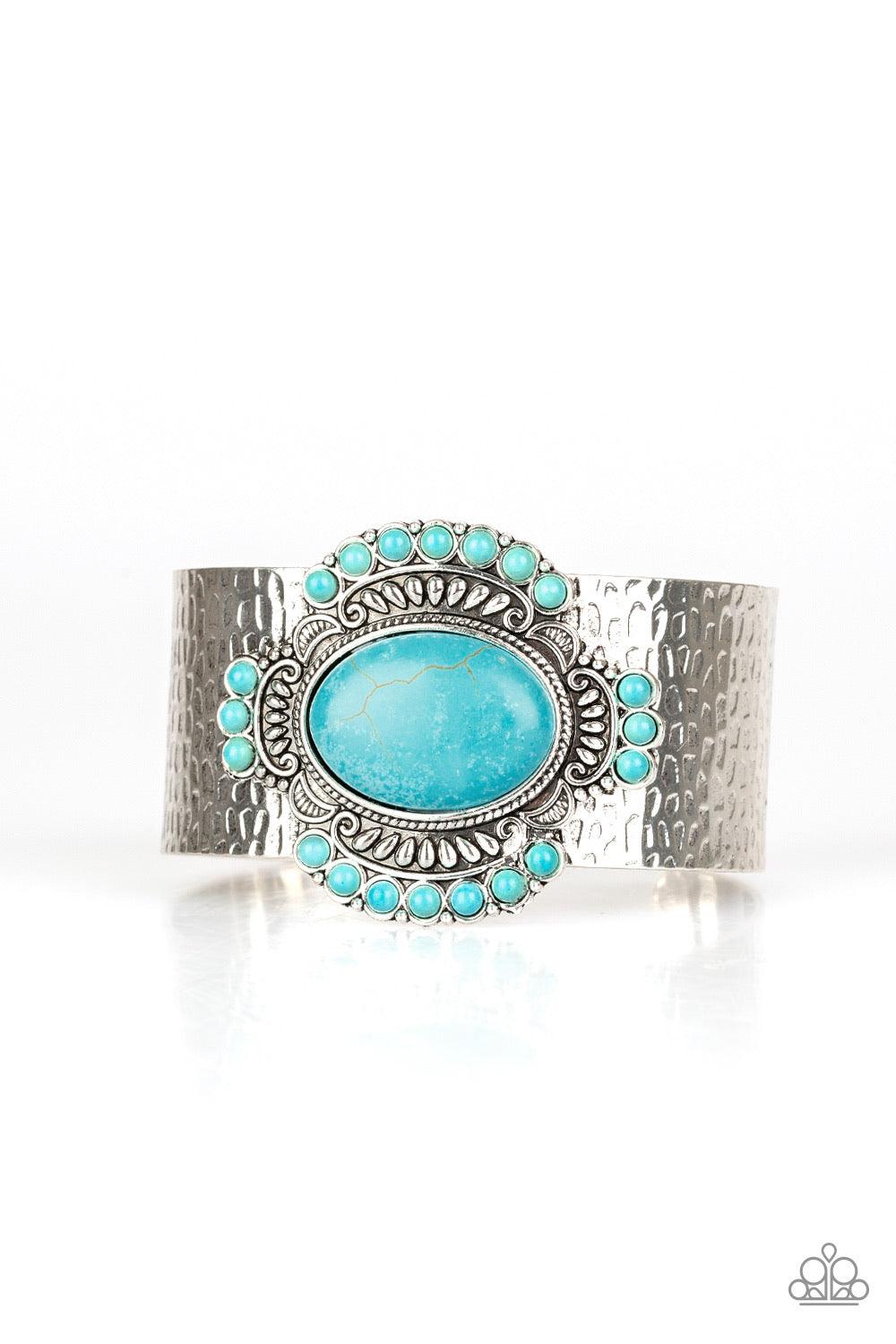 Paparazzi Accessories Canyon Crafted ~Blue Radiating with refreshing turquoise stones and tribal inspired patterns, an ornate stone frame is pressed into the center of a hammered silver cuff for an artisan flair.
