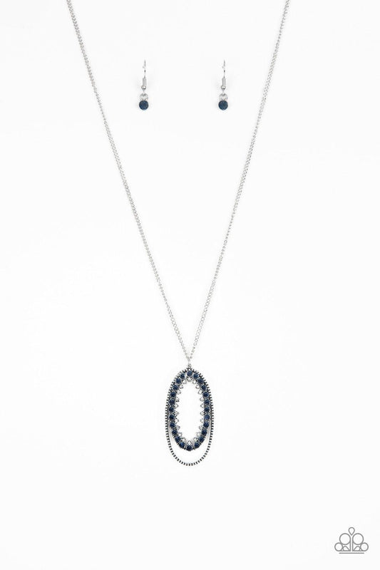 Paparazzi Accessories Money Mood - Blue Ringed in a studded silver frame, glittery blue and white rhinestones collect into a glamorous pendant at the bottom of a lengthened silver chain for a refined flair. Features an adjustable clasp closure. Sold as on