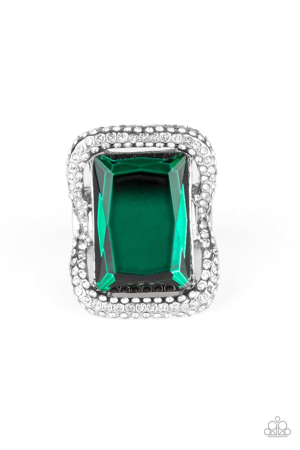 Paparazzi Accessories Deluxe Decadence - Green Featuring a regal emerald style cut, an oversized green gem nestles inside a rounded square silver frame encrusted in glassy white rhinestones for a dramatically glamorous look. Features a stretchy band for a