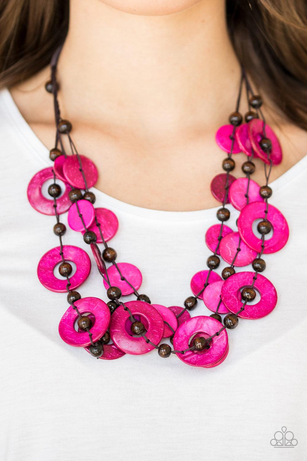 Paparazzi Accessories Catalina Coastin - Pink Brushed in a shell-like iridescence, vivacious pink wooden discs and round brown wooden beads are knotted along three strands of brown cording for a summery look. Features a button loop closure. Jewelry