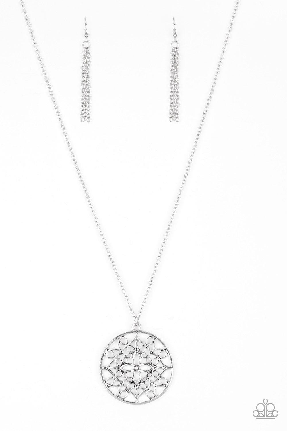 Paparazzi Accessories Mandala Melody - Silver Featuring a whimsical mandala pattern, a glistening silver pendant swings from the bottom of a lengthened silver chain for a seasonal look. Features an adjustable clasp closure. Jewelry