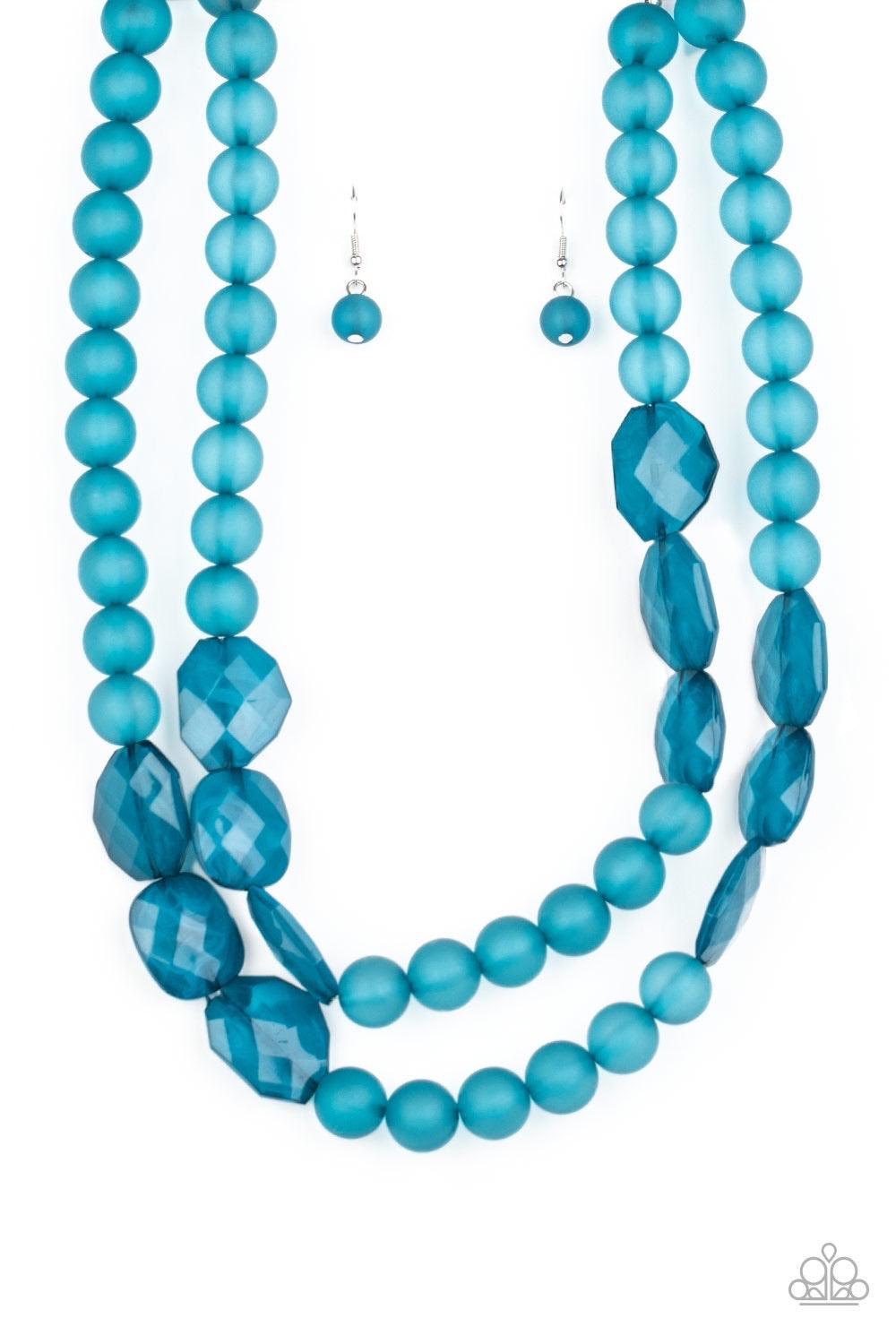 Paparazzi Accessories Arctic Art - Blue Featuring round and imperfectly flat shapes, an icy compilation of opaque Mosaic Blue beads are threaded along invisible wires, creating colorfully glassy layers below the collar. Features an adjustable clasp closur