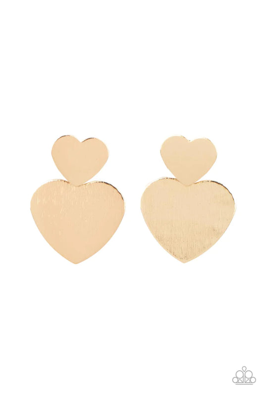 Paparazzi Accessories Heart-Racing Refinement - Gold Delicately scratched in shimmer, a dainty gold heart frame delicately links with a larger gold heart frame for a flirtatiously layered look. Earring attaches to a standard post earring. Sold as one pair
