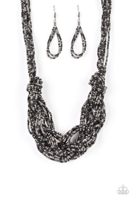 Paparazzi Accessories City Catwalk - Black Brushed in a flashy finish, countless strands of black and gunmetal seed beads weave into a bulky square braid below the collar for a glamorous look. Features an adjustable clasp closure. Sold as one individual n