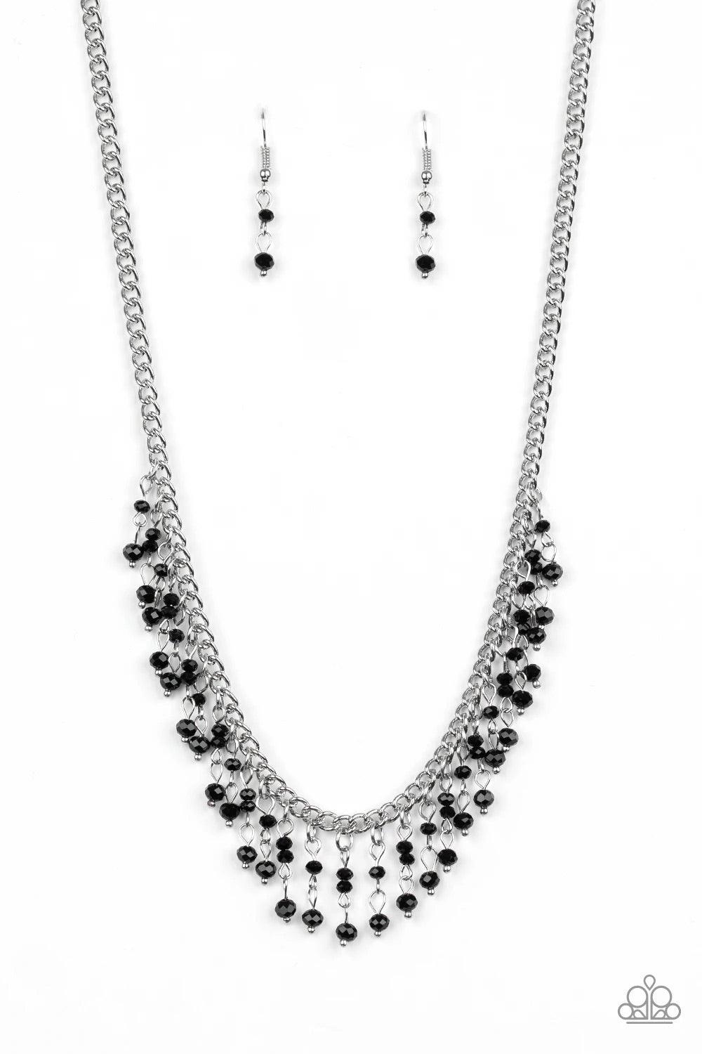 Paparazzi Accessories Sporadic Sparkle - Black A collection of dainty black crystal-like beads are threaded along stacks of metallic rods, creating a twinkling fringe below the collar. Features an adjustable clasp closure. Sold as one individual necklace.