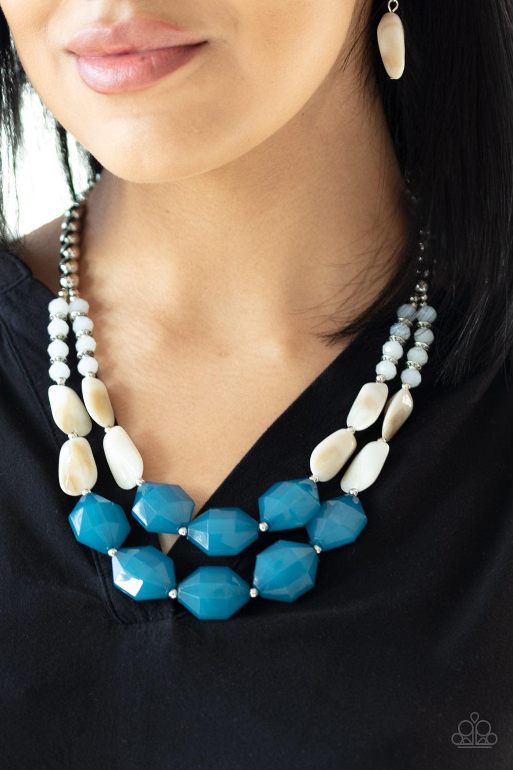 Paparazzi Accessories Seacoast Sunset - Blue A whimsical collection of silver, opaque crystal-like, cloudy white, and faceted blue beads are threaded along invisible wires, creating statement-making layers below the collar. Features an adjustable clasp cl