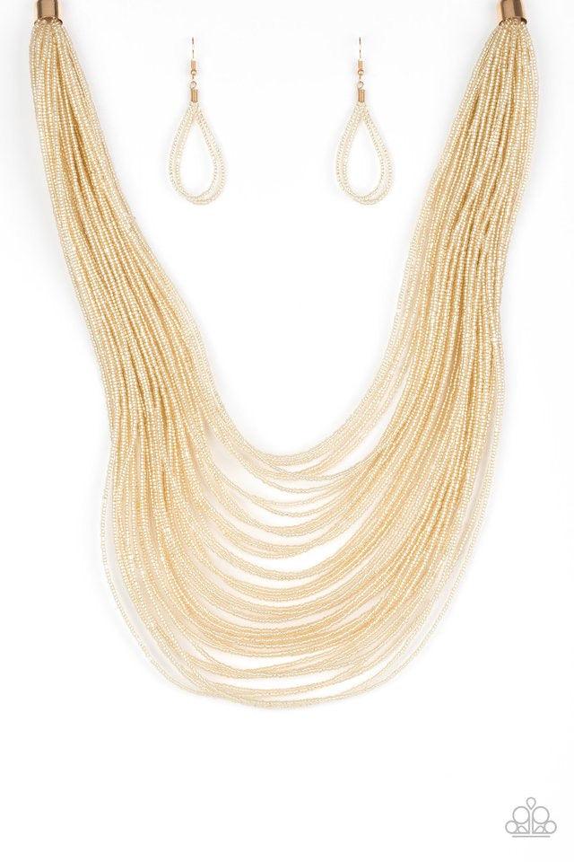 Paparazzi Accessories Streaming Starlight - Gold Brushed in a crystal-like shimmer, countless strands of gold seed beads drape across the chest in a bold fashion. Featuring a collision of shapes and shimmer, the glittery strands connect to two large gold