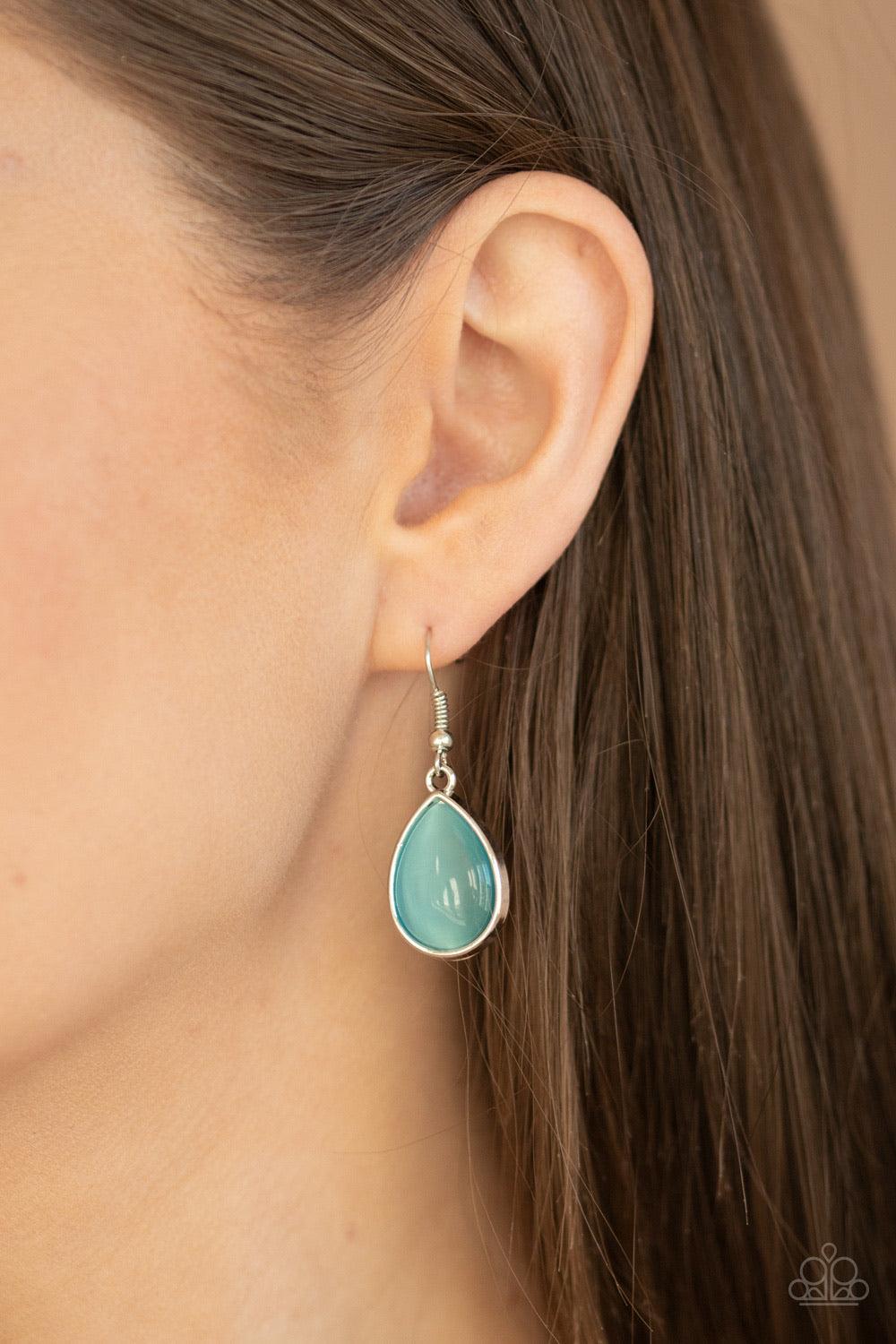 Paparazzi Accessories Dewy Decadence - Blue A series of blue cat's eye teardrops interlock at the bottom of a silver chain, giving way to an oversized teardrop pendant for a refined finish. Features an adjustable clasp closure. Jewelry