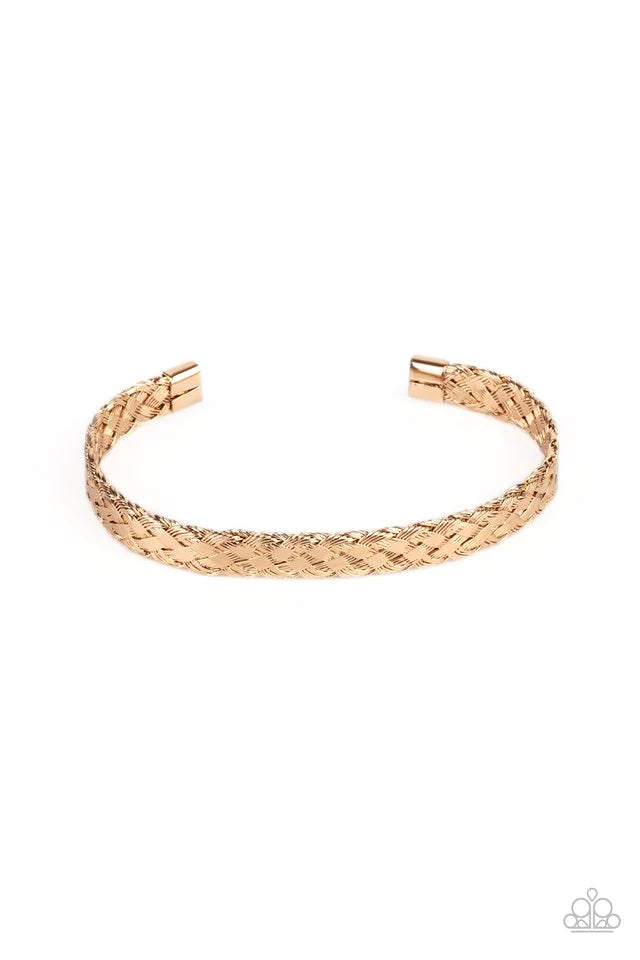 Paparazzi Accessories Cable Couture - Gold Featuring flattened sections, glistening gold wires tightly weave into a dainty cuff for an edgy look around the wrist. Jewelry