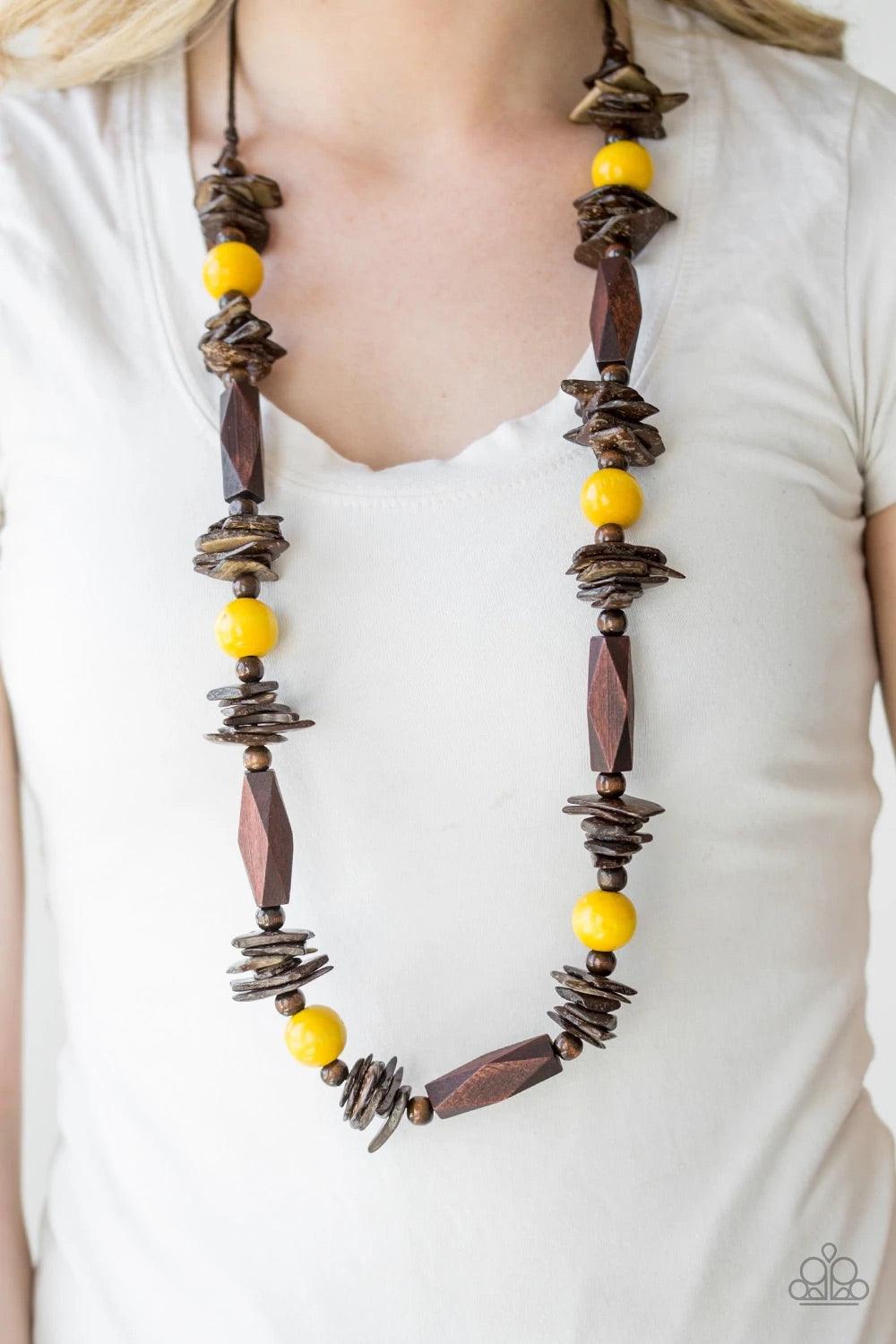 Paparazzi Accessories Cozumel Coast - Yellow Featuring round, faceted, and distressed finishes, mismatched brown wooden beads are threaded along shiny brown cording. Vivacious yellow wooden beads trickle between the earthy accents, adding a colorful finis