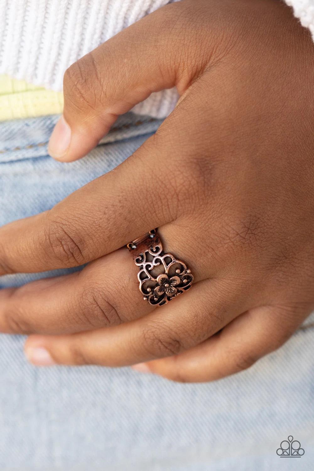Paparazzi Accessories Fanciful Flower Gardens - Copper Glistening copper filigree blooms from a shimmery floral center, creating a whimsical band across the finger. Features a stretchy band for a flexible fit. Sold as one individual r Jewelry