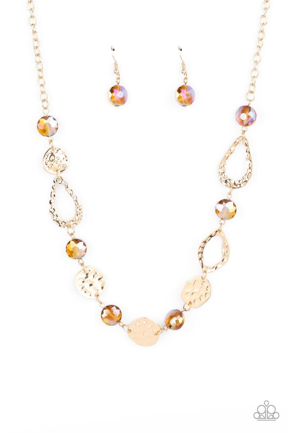 Paparazzi Accessories High Fashion Fashionista - Brown Hammered gold frames and imperfect gold ovals link with iridescent topaz gems below the collar, creating a colorful display. Features an adjustable clasp closure. Sold as one individual necklace. Incl