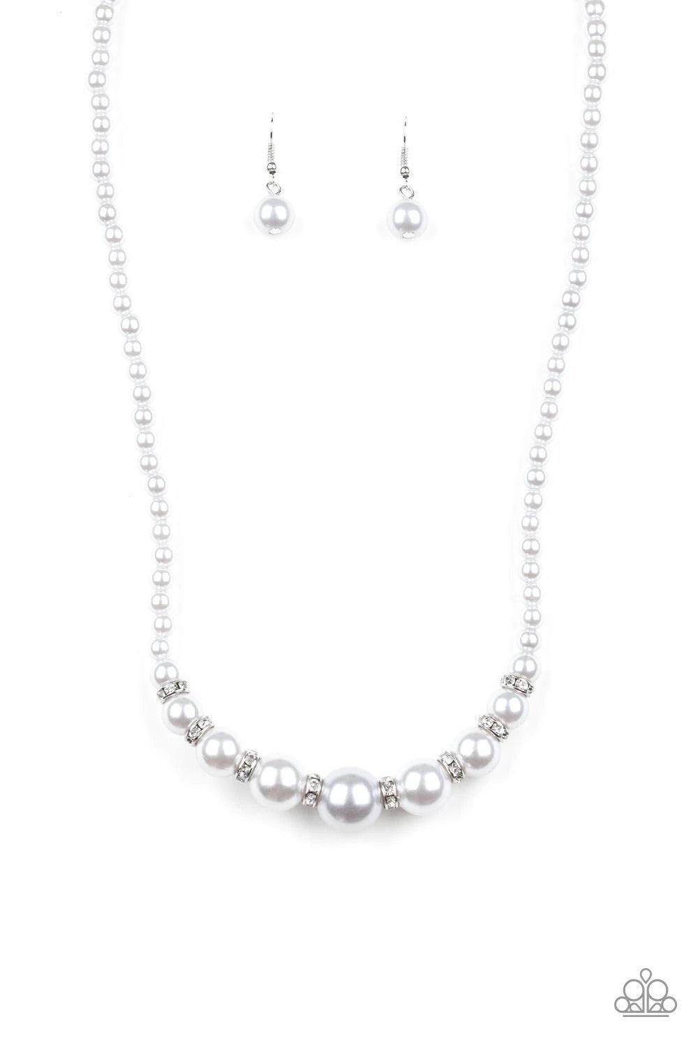 Paparazzi Accessories SoHo Sweetheart - Silver Threaded along an invisible wire, dainty silver pearls give way to an alternating collection of larger silver pearls and white rhinestone encrusted rings below the collar for a timeless sparkle. Features an a
