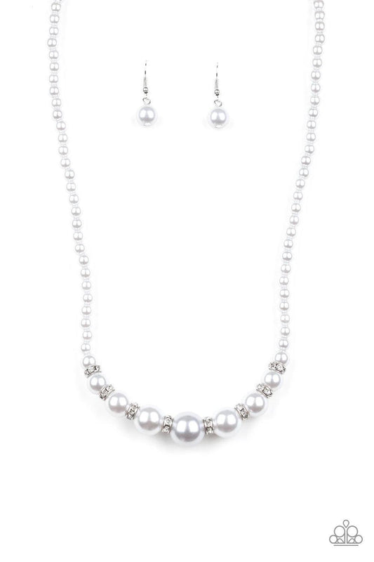 Paparazzi Accessories SoHo Sweetheart - Silver Threaded along an invisible wire, dainty silver pearls give way to an alternating collection of larger silver pearls and white rhinestone encrusted rings below the collar for a timeless sparkle. Features an a
