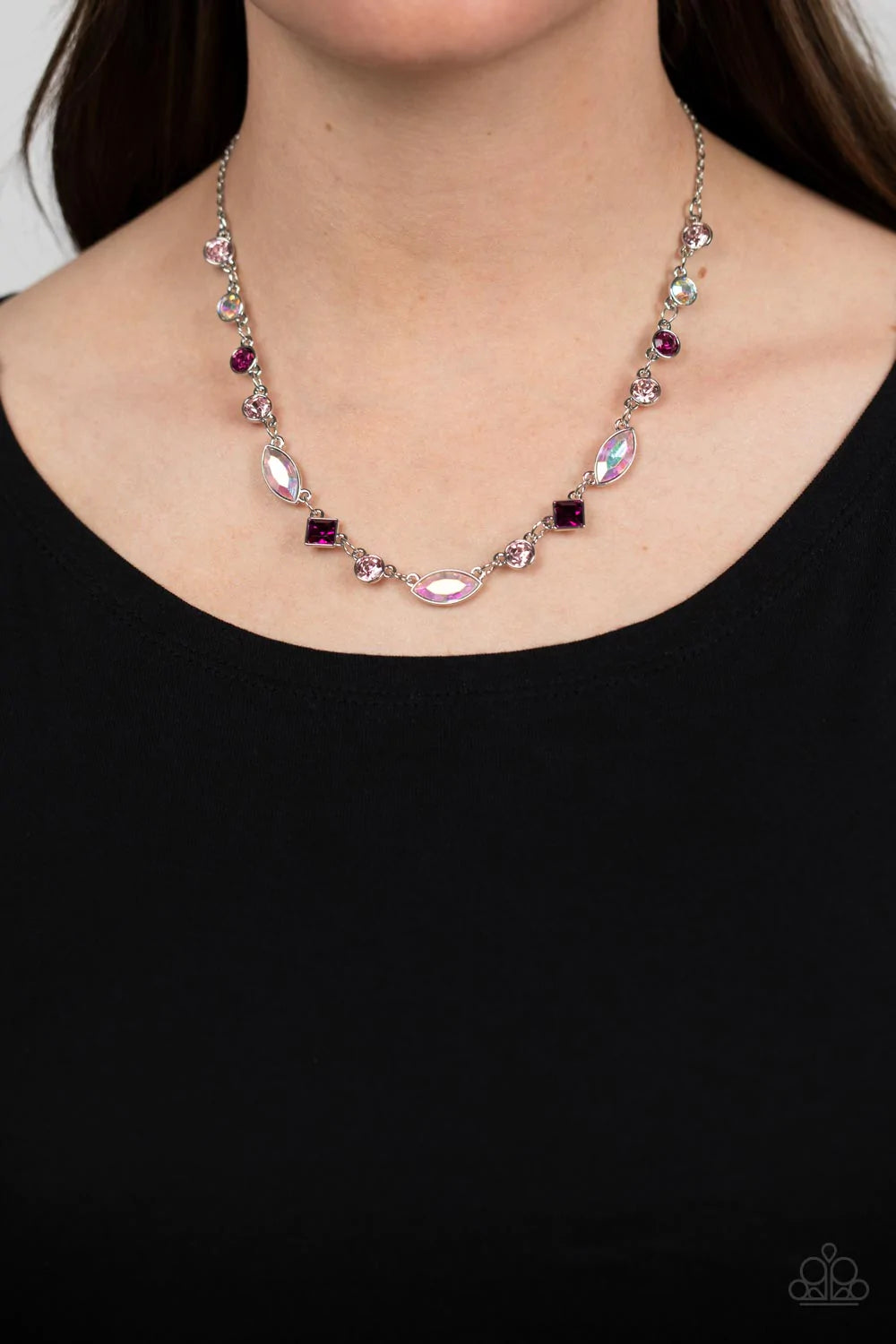 Paparazzi Accessories Irresistible HEIR-idescene - Pink Varying in geometric shapes and shades of pink, glittery rose and fuchsia gems are sprinkled between iridescent rhinestone accents for a dreamy refined, and irresistible finish. Features an adjustabl