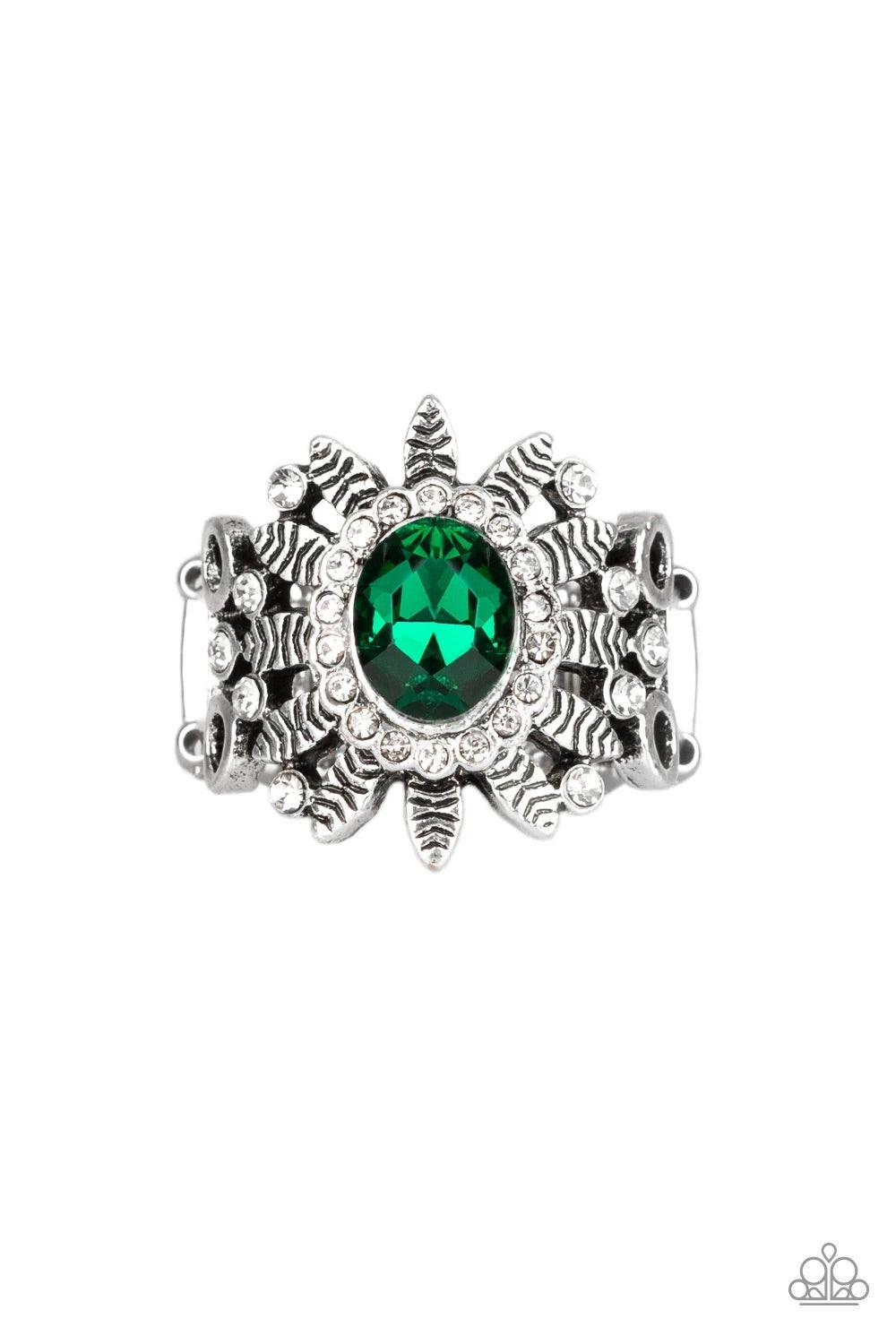 Paparazzi Accessories Burn Bright - Green Ringed in glittery white rhinestones, a sparkling green gem is pressed into the center of a leafy silver frame. Dainty white rhinestones are sprinkled along the shimmery foliage for a refined finish. Features a st