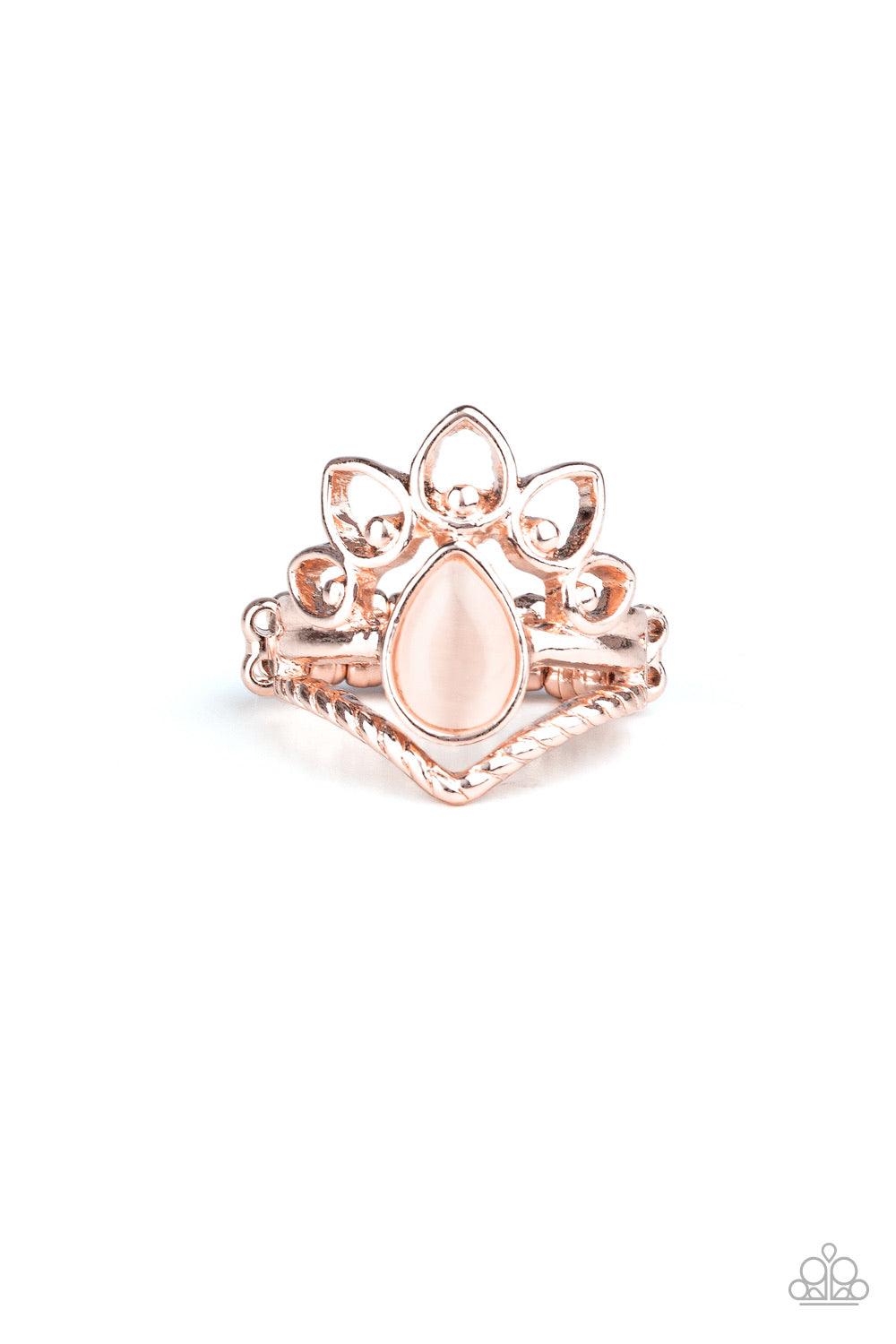 Paparazzi Accessories Serene Scene - Rose Gold Dotting the center of a dainty shiny gold band, a milky peach cat's eye stone teardrop is flanked between an angled rope-like band and an airy fan of studded rose gold petals. Features a dainty stretchy band