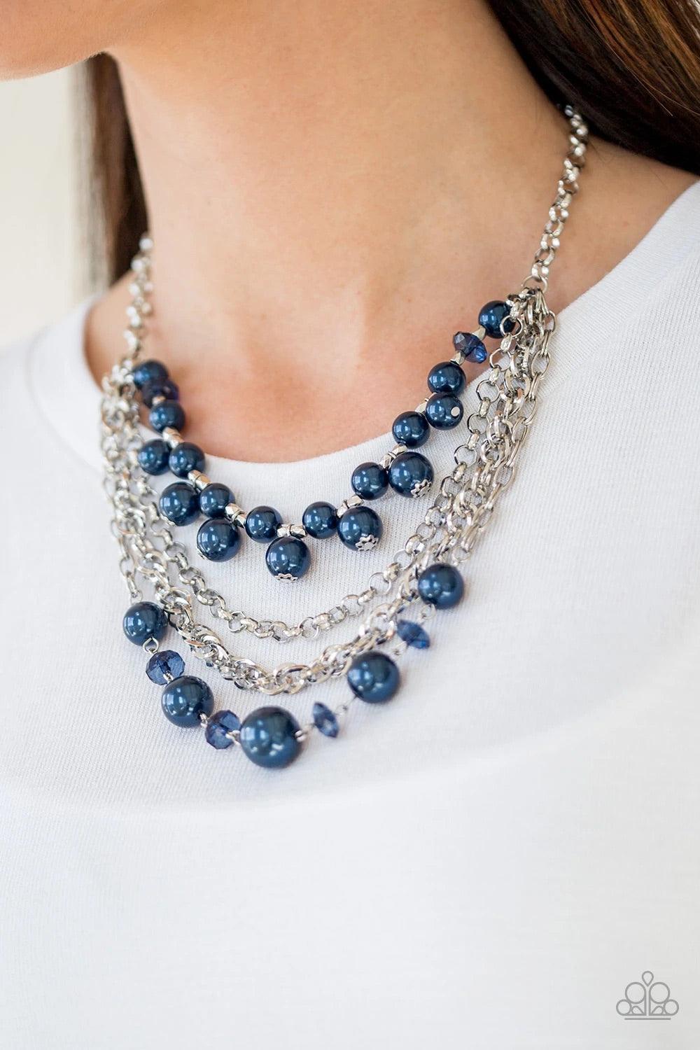 Paparazzi Accessories Rockin’ Rockette - Blue Varying in size, blue pearls, blue crystal-like beads, and faceted silver beads join with mismatched silver chains below the collar, creating a radically refined fringe. Features an adjustable clasp closure. S