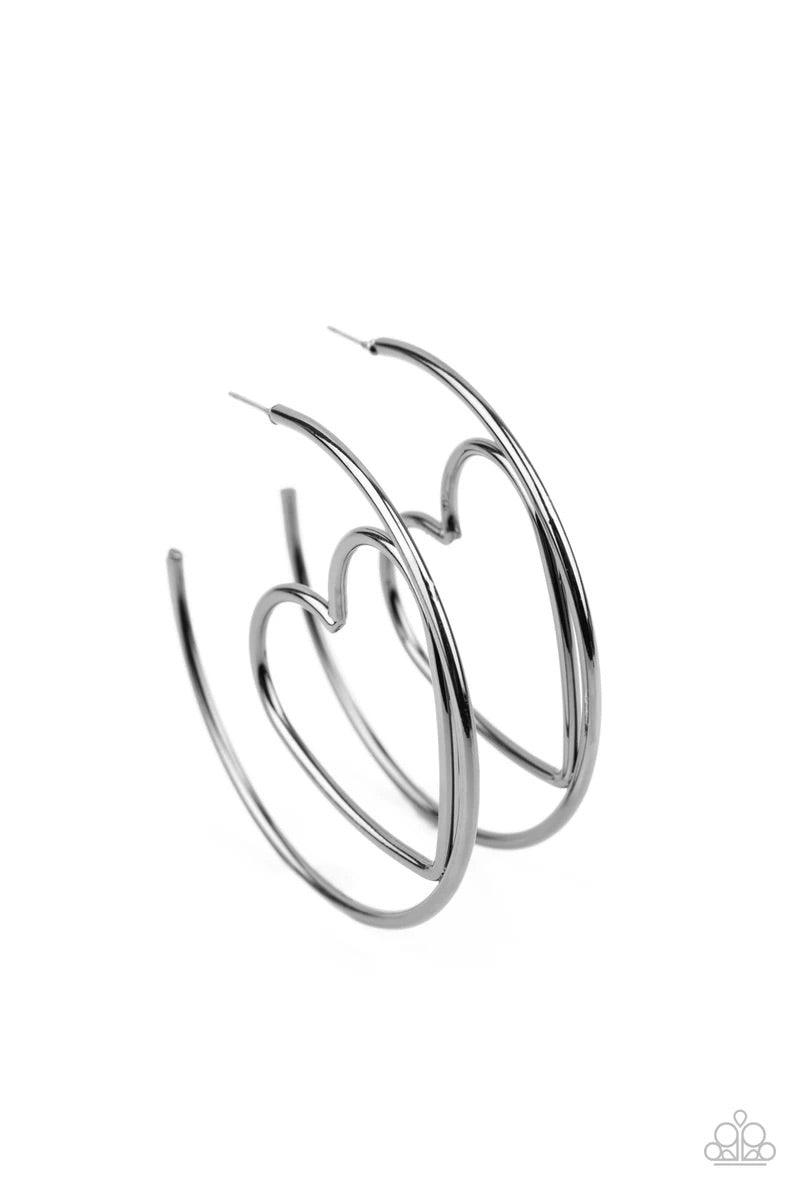 Paparazzi Accessories Love At First Bright - Black Glistening gunmetal wire delicately bends into an airy heart frame inside a classic gunmetal hoop, creating a flirtatious display. Earring attaches to a standard post fitting. Hoop measures approximately