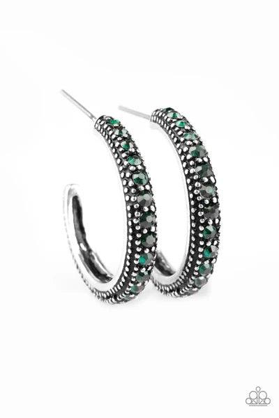 Paparazzi Accessories Twinkling Tinseltown - Green ENCRUSTED IN DAZZLING EMERALD RHINESTONES, A STUDDED SILVER HOOP SWINGS FROM THE EAR FOR A GLAMOROUS LOOK. EARRING ATTACHES TO A STANDARD POST FITTING. HOOP MEASURES 1" IN DIAMETER. SOLD AS ONE PAIR OF HO