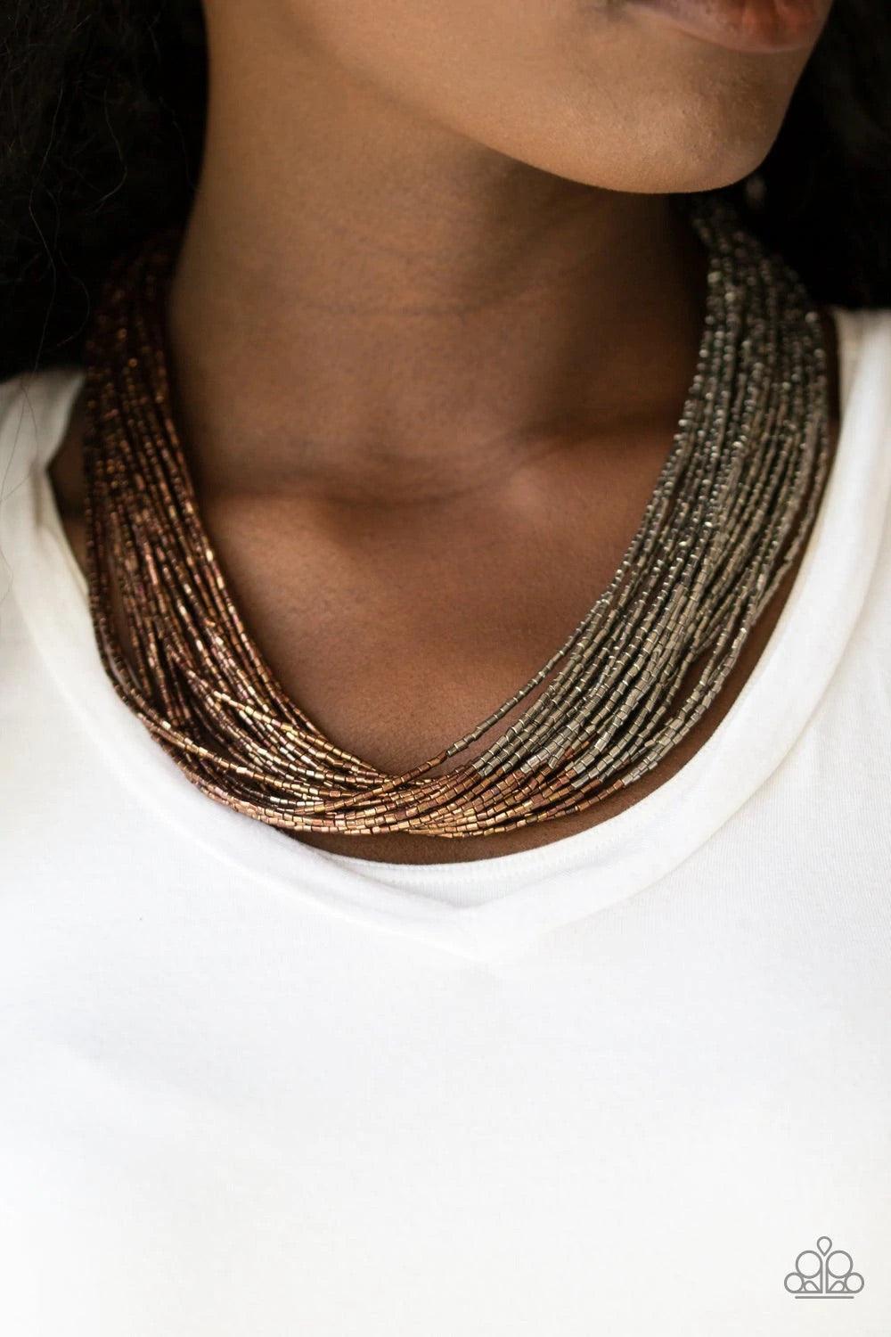 Paparazzi Accessories Flashy Fashion - Brass Brushed in a flashy metallic finish, countless strands of brass seed beads converge with strands of gunmetal seed beads, creating colorful layers below the collar. Features an adjustable clasp closure. Jewelry