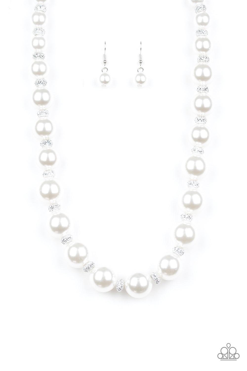 Paparazzi Accessories Uptown Heiress - White Infused with dainty silvery rhinestone encrusted beads, a refined collection of oversized white pearls are threaded along an invisible wire below the collar for a timeless dazzle. Features an adjustable clasp c