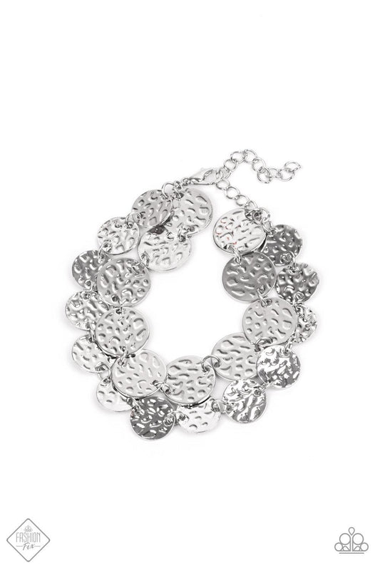 Paparazzi Accessories Rooted To The SPOTLIGHT - Silver Two rows of hammered silver discs wrap around the wrist, creating an edgy shimmer. Features an adjustable clasp closure. Sold as one individual bracelet. Jewelry