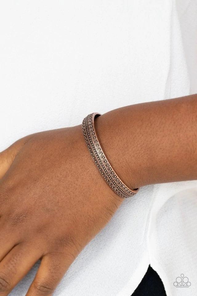 Paparazzi Accessories Peak Conditions - Copper Embossed and studded in geometric patterns, an antiqued copper cuff curls across the wrist for a dainty look. Sold as one individual bracelet. Jewelry