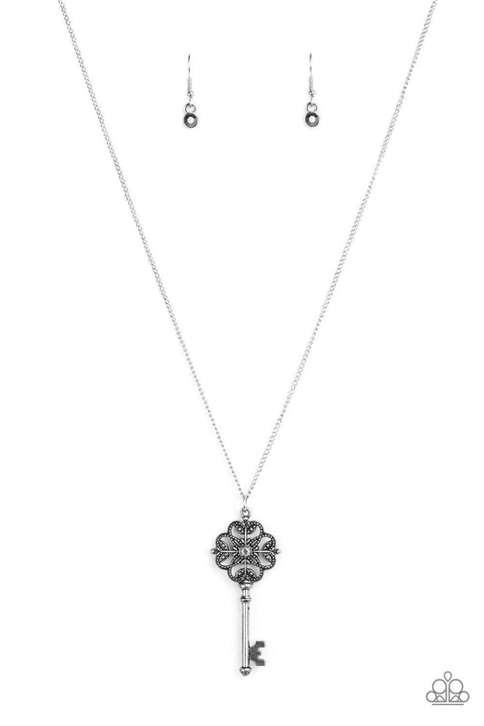 Paparazzi Accessories Got It On Lock - Silver Dotted with a glittery hematite rhinestone, a vintage inspired key pendant swings from the bottom of an elegantly elongated silver chain for a whimsical look. Features an adjustable clasp closure. Jewelry